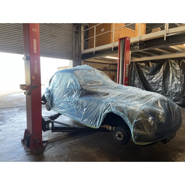 Vehicle safely wrapped in Masking Coveroll